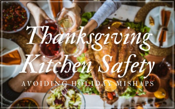 Hand reaching for a glass during Thanksgiving dinner, emphasizing kitchen safety.