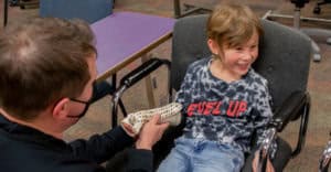 Child receiving hand therapy at Alaska Hand Rehab clinic.