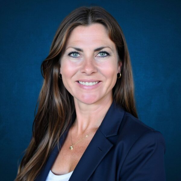Professional woman at Alaska Hand Rehab clinic, focused on hand therapy.